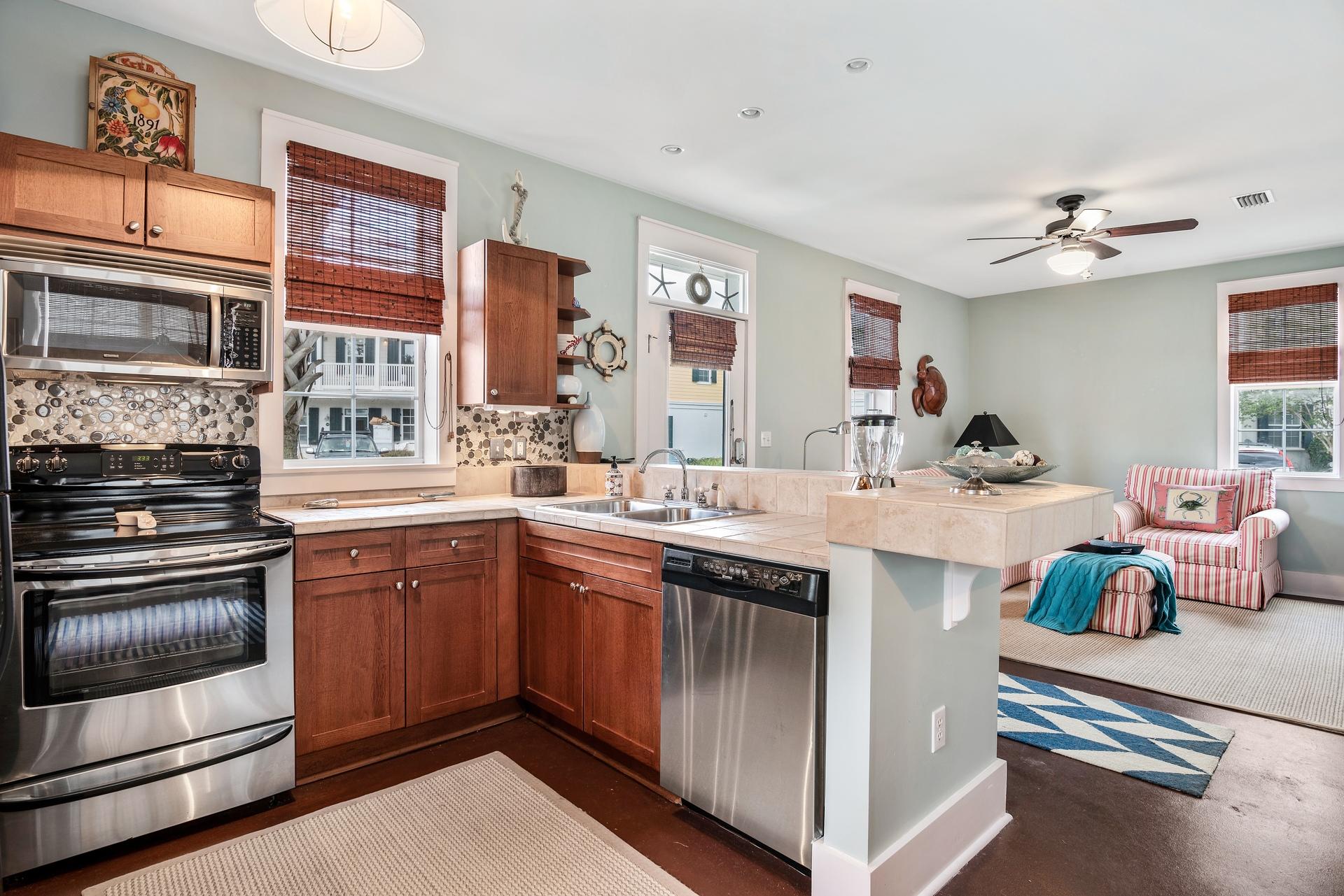 198 Somerset Bridge Road, Unit 155 Santa Rosa Beach, FL 32459 - Photo 11 of 22 a kitchen with stainless steel appliances granite countertop a sink and cabinets