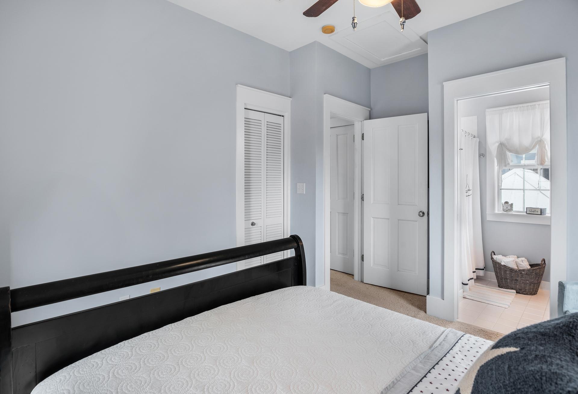 198 Somerset Bridge Road, Unit 155 Santa Rosa Beach, FL 32459 - Photo 14 of 22 a bedroom with a bed and a chandelier