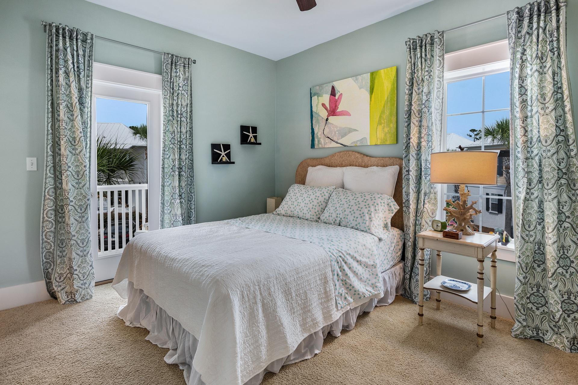 198 Somerset Bridge Road, Unit 155 Santa Rosa Beach, FL 32459 - Photo 17 of 22 a bedroom with a bed and a painting on the wall