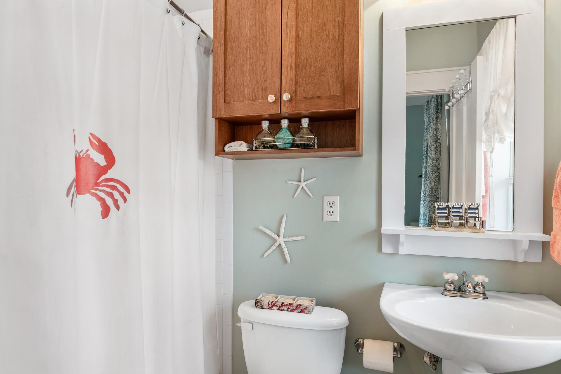198 Somerset Bridge Road, Unit 155 Santa Rosa Beach, FL 32459 - Photo 19 of 22 a bathroom with a sink mirror and toilet