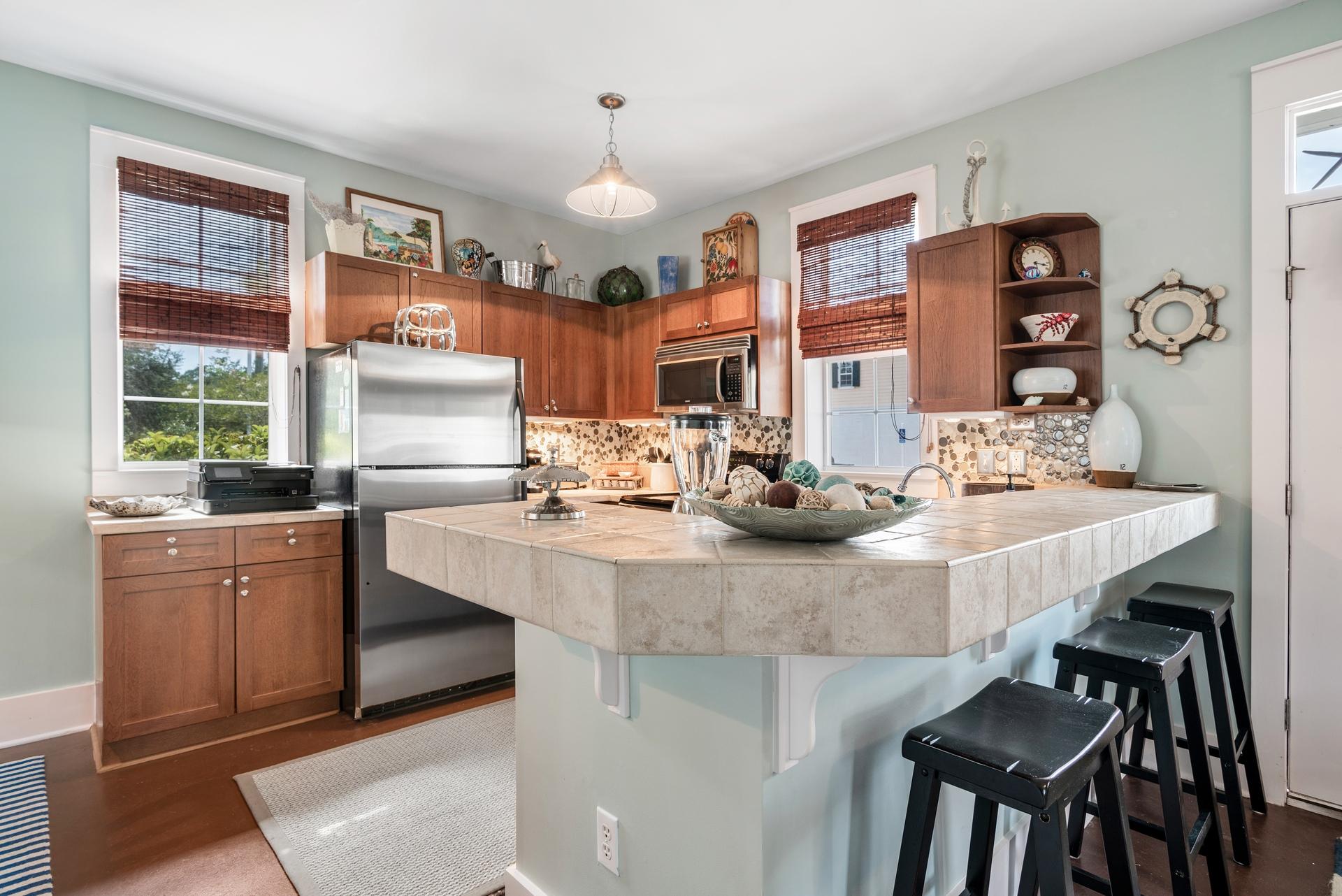 198 Somerset Bridge Road, Unit 155 Santa Rosa Beach, FL 32459 - Photo 8 of 22 a kitchen with a table and chairs in it