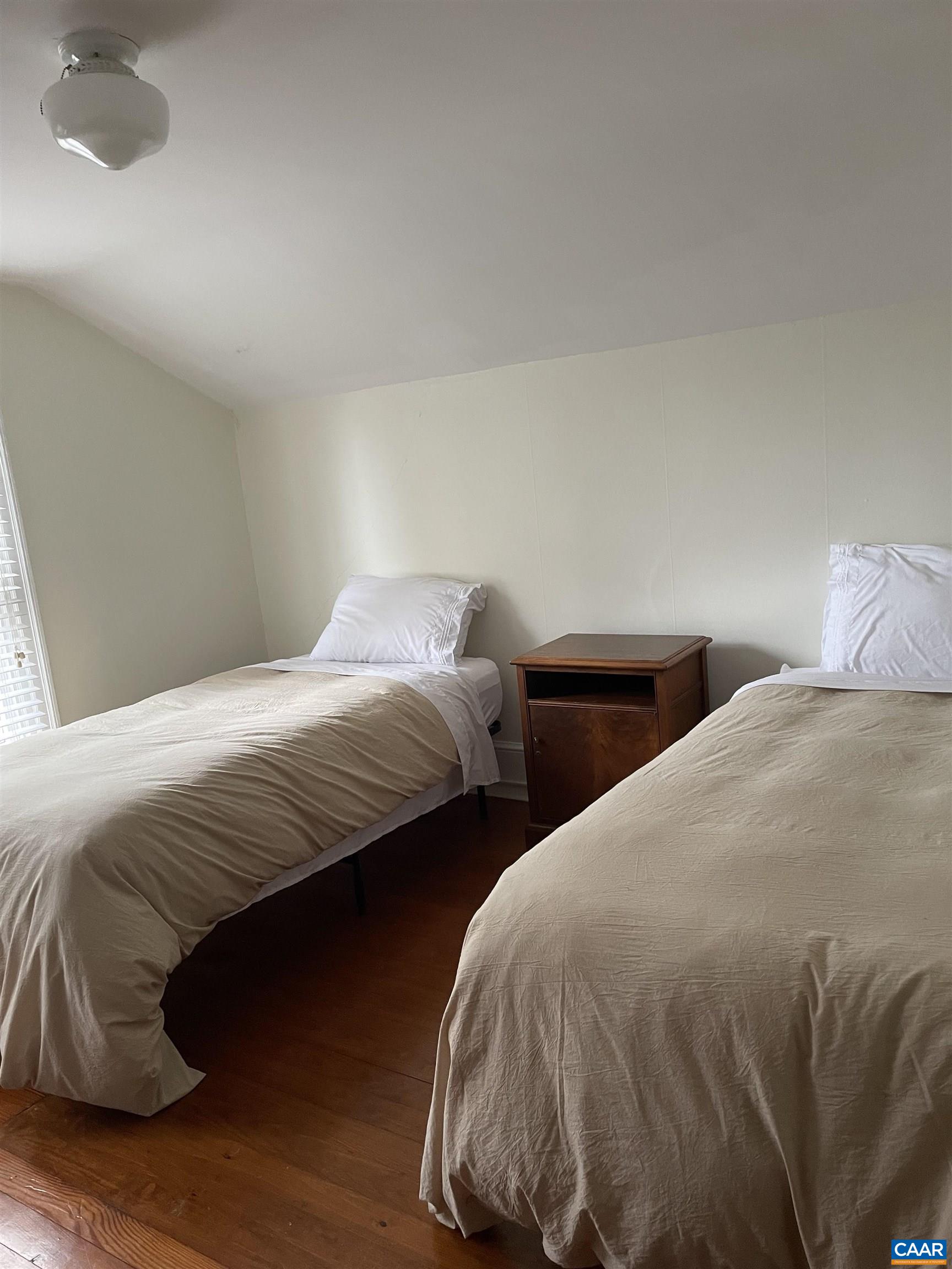191 Barbour Street Orange, VA 22960 - Photo 17 of 19 a bedroom with two beds and a chair