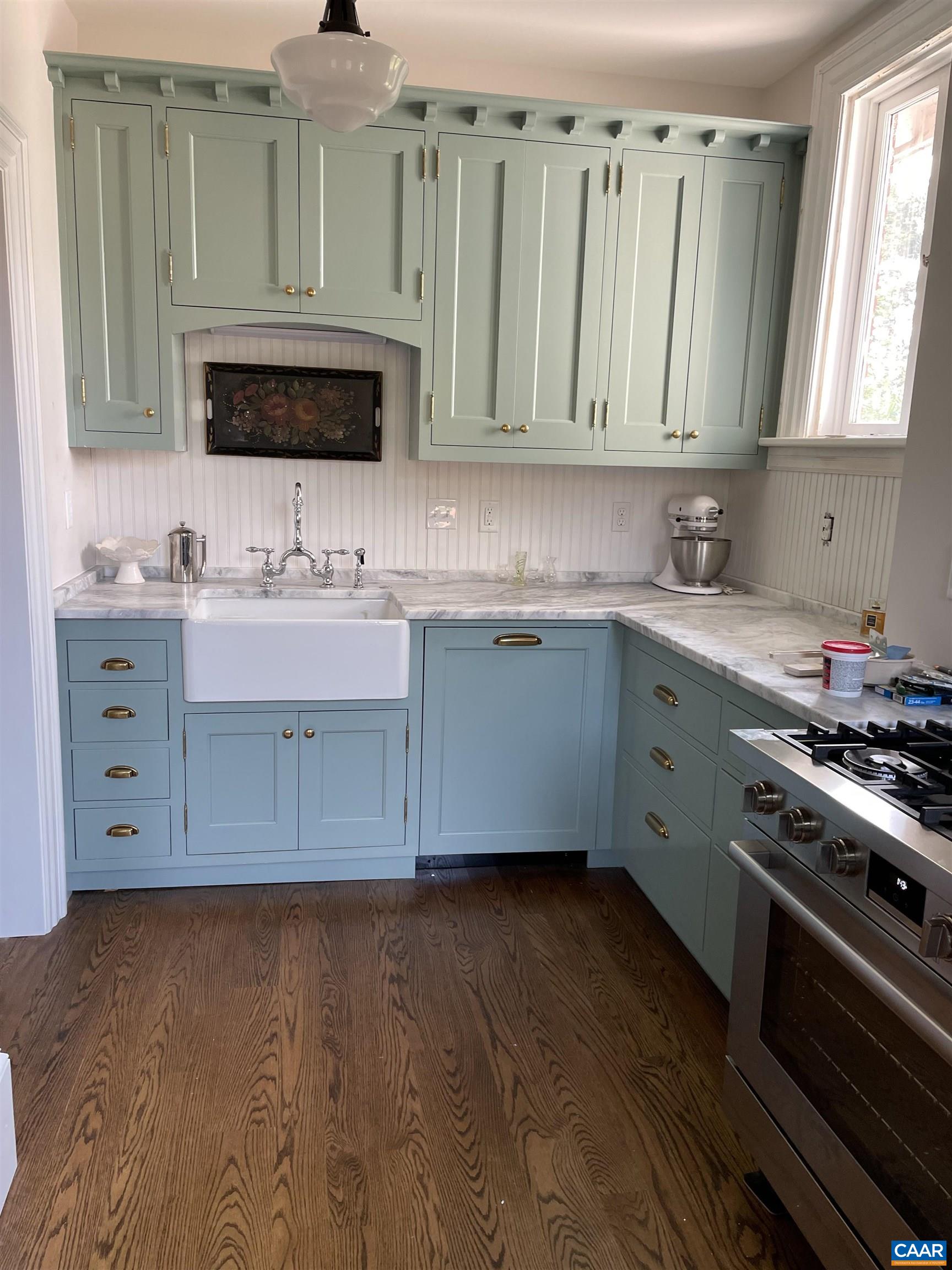 191 Barbour Street Orange, VA 22960 - Photo 3 of 19 a kitchen with stainless steel appliances a sink a stove and cabinets
