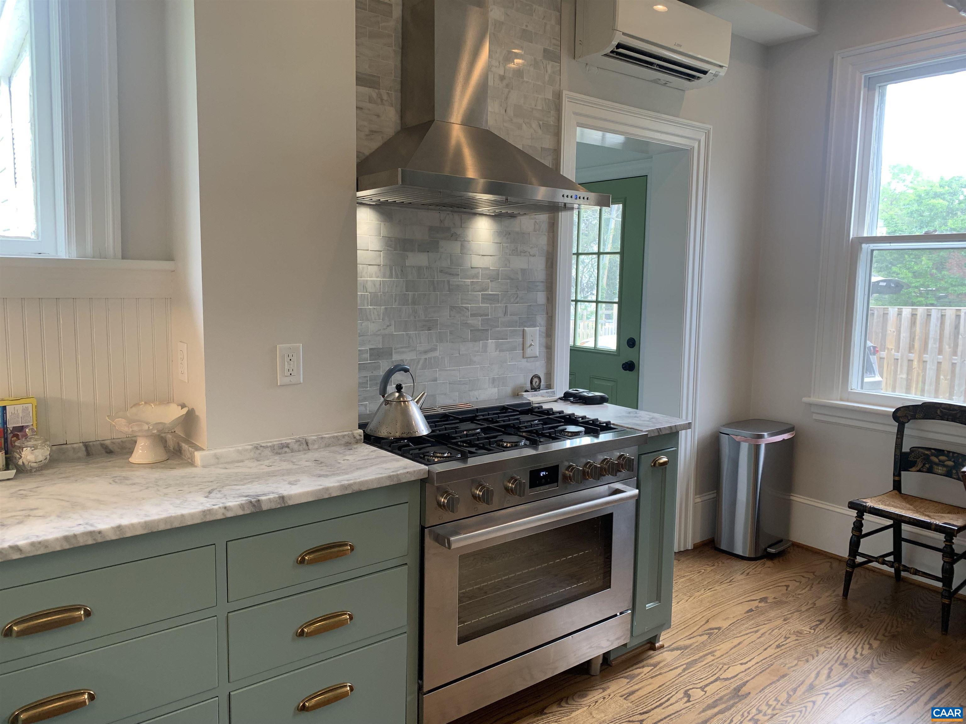 191 Barbour Street Orange, VA 22960 - Photo 5 of 19 a kitchen with granite countertop a stove and a sink