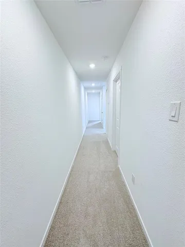 a bathroom with a bathtub shower sink vanity mirror and toilet