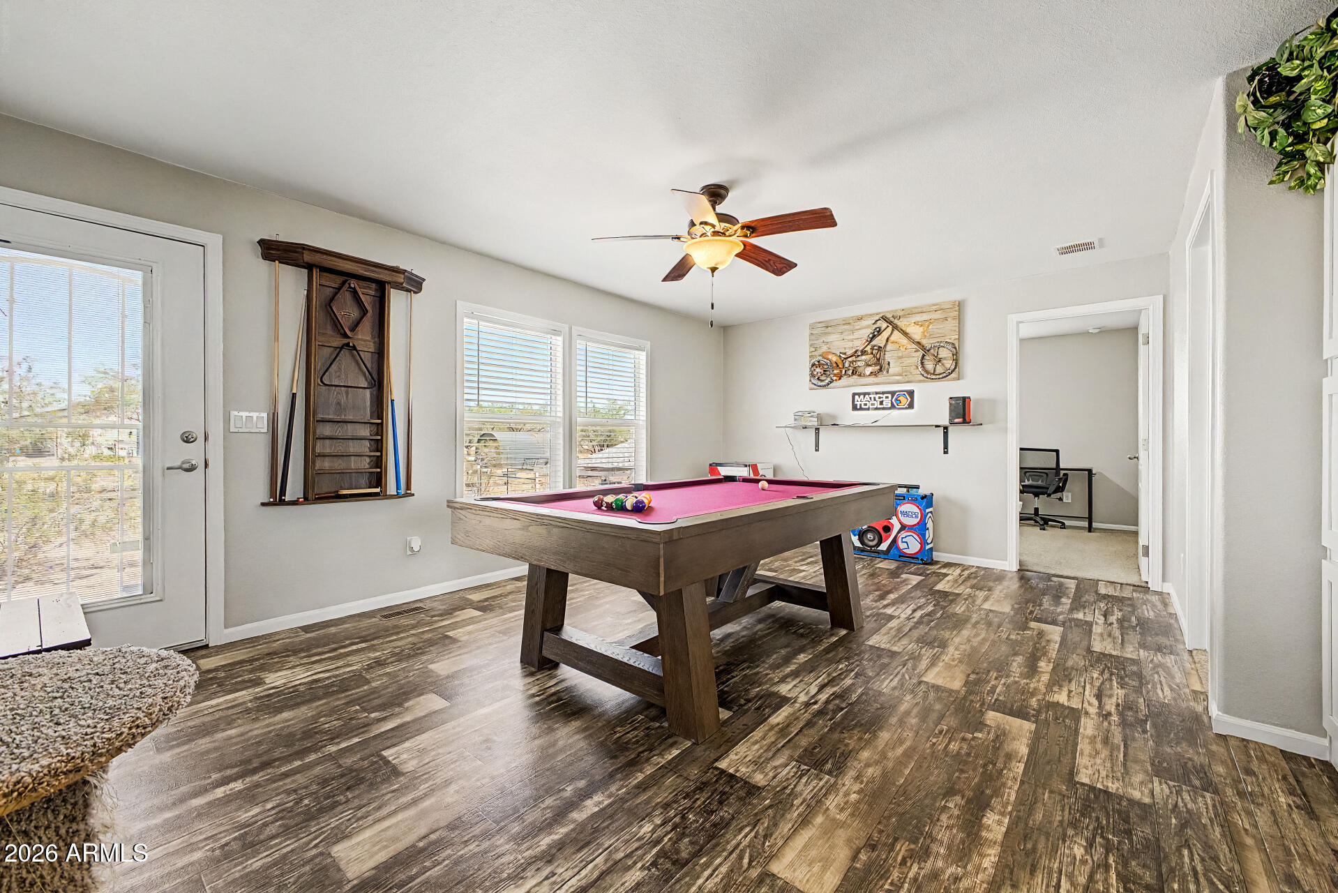 22417 West Dove Valley Road Wittmann, AZ 85361 - Photo 16 of 53 a living room with a table and a window
