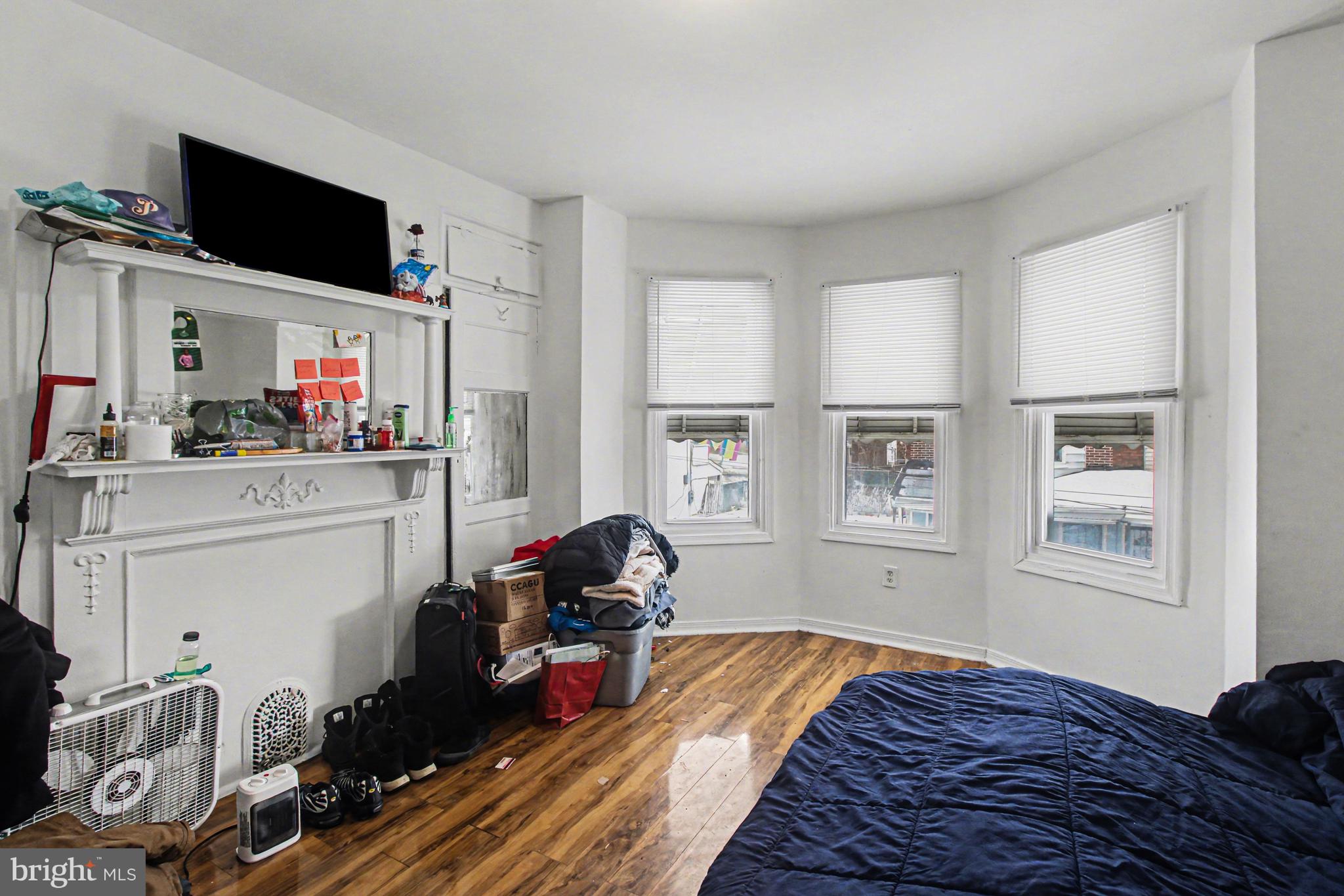 14 South Ruby Street Philadelphia, PA 19139 - Photo 13 of 28 a bed room with a bed and a flat tv screen