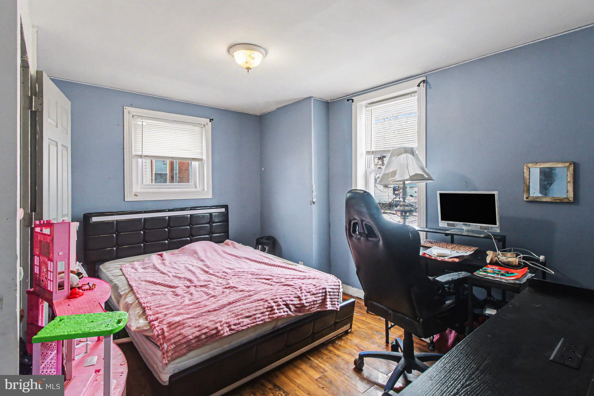 14 South Ruby Street Philadelphia, PA 19139 - Photo 15 of 28 a bedroom with a bed table chair and a window