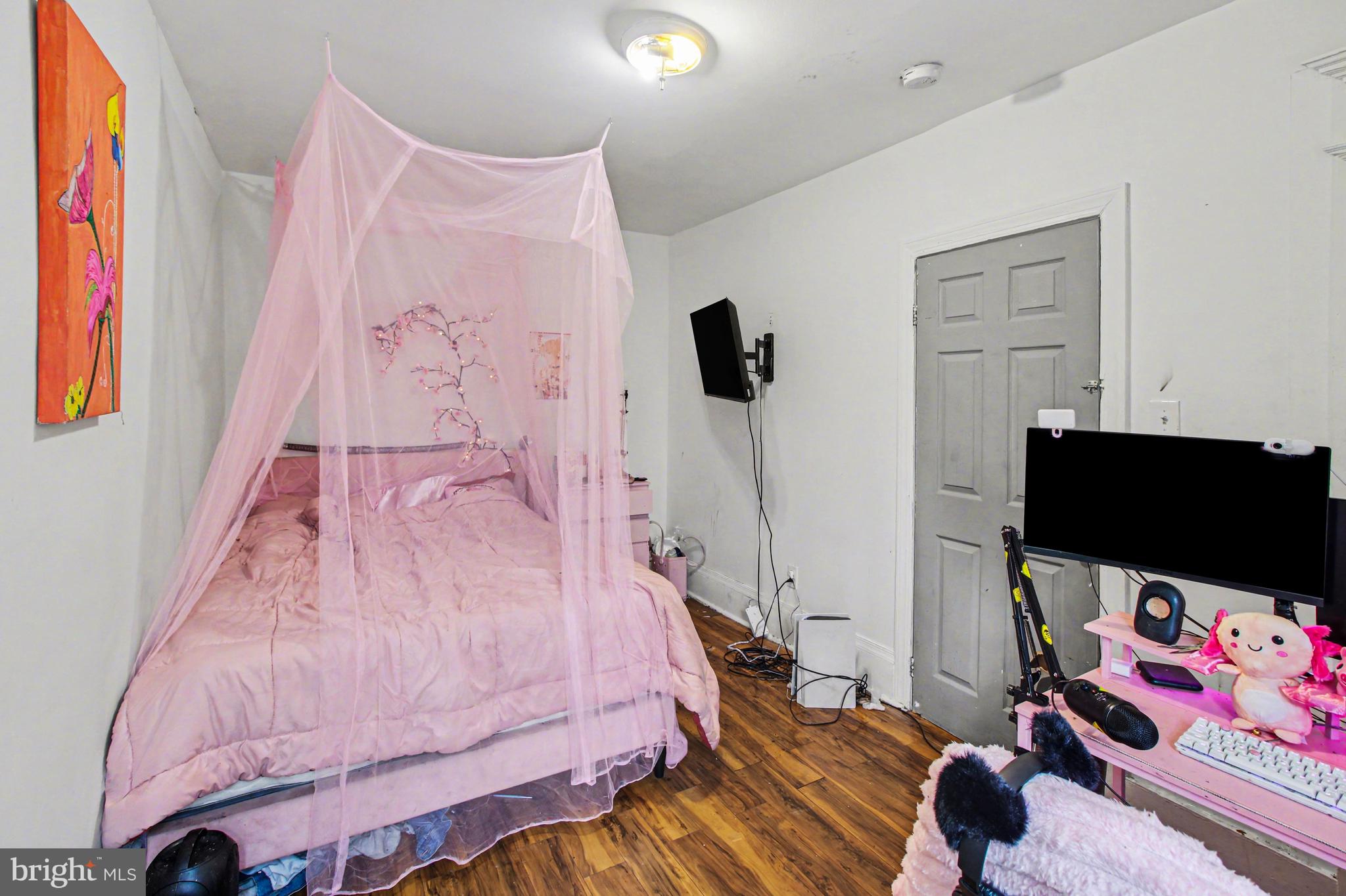 14 South Ruby Street Philadelphia, PA 19139 - Photo 16 of 28 a bedroom with a bed and a flat screen tv