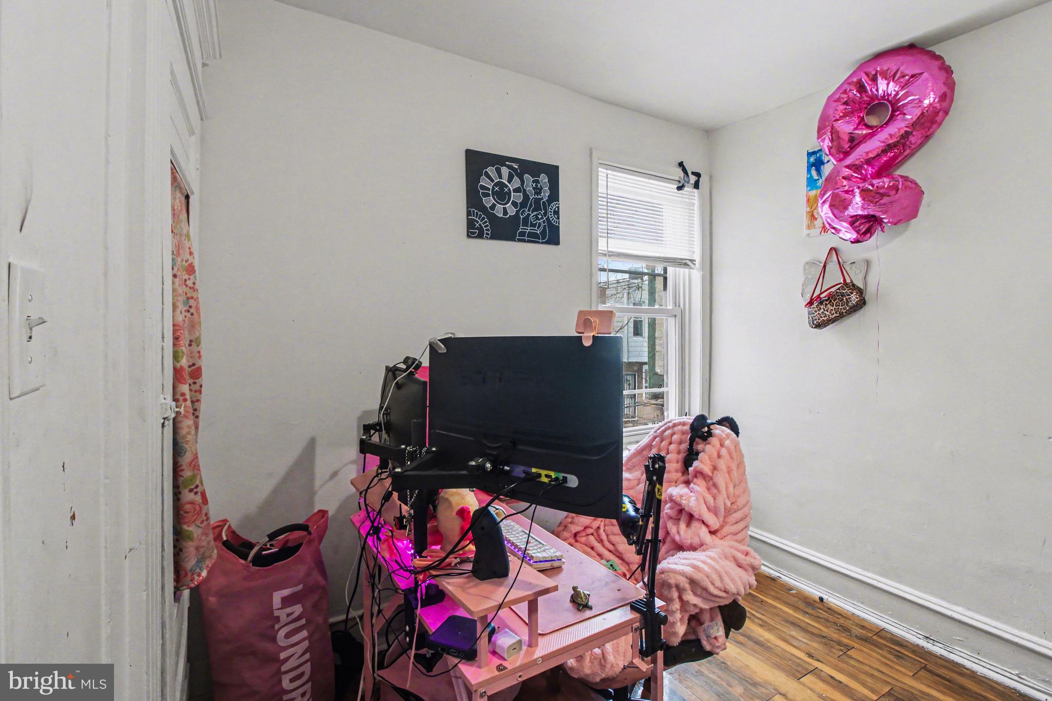 14 South Ruby Street Philadelphia, PA 19139 - Photo 17 of 28 a bedroom with a bed and a flat screen tv