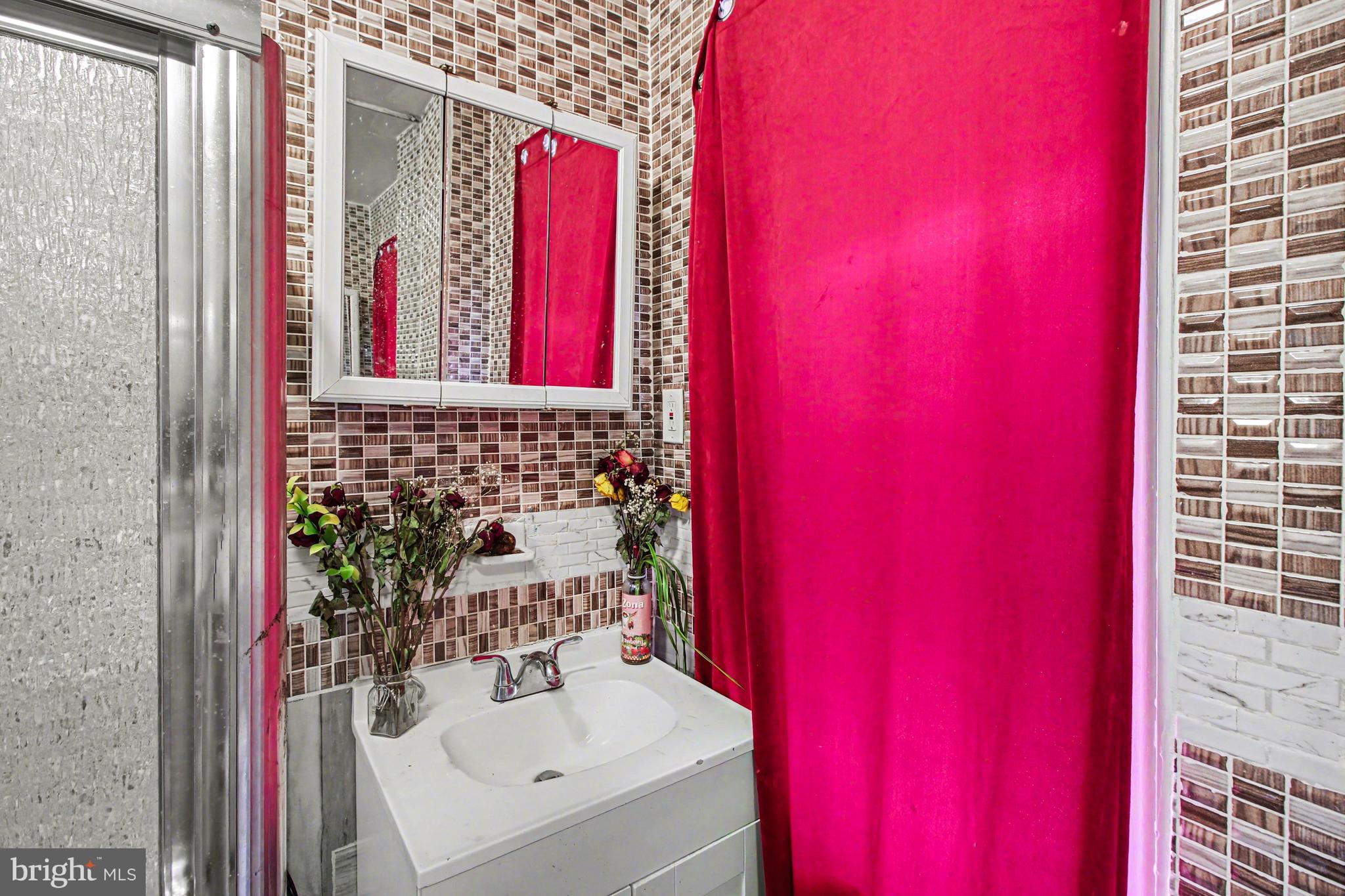 14 South Ruby Street Philadelphia, PA 19139 - Photo 19 of 28 a bathroom with a sink and a mirror