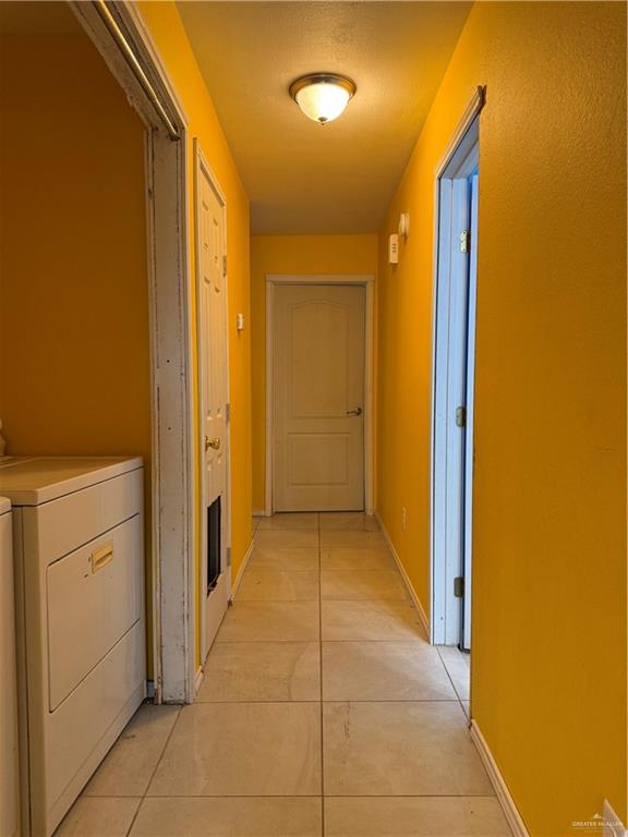 307 Hawaii Street Alton, TX 78573 - Photo 11 of 17 Hallway with tile flooring and a ceiling-mounted light fixture
