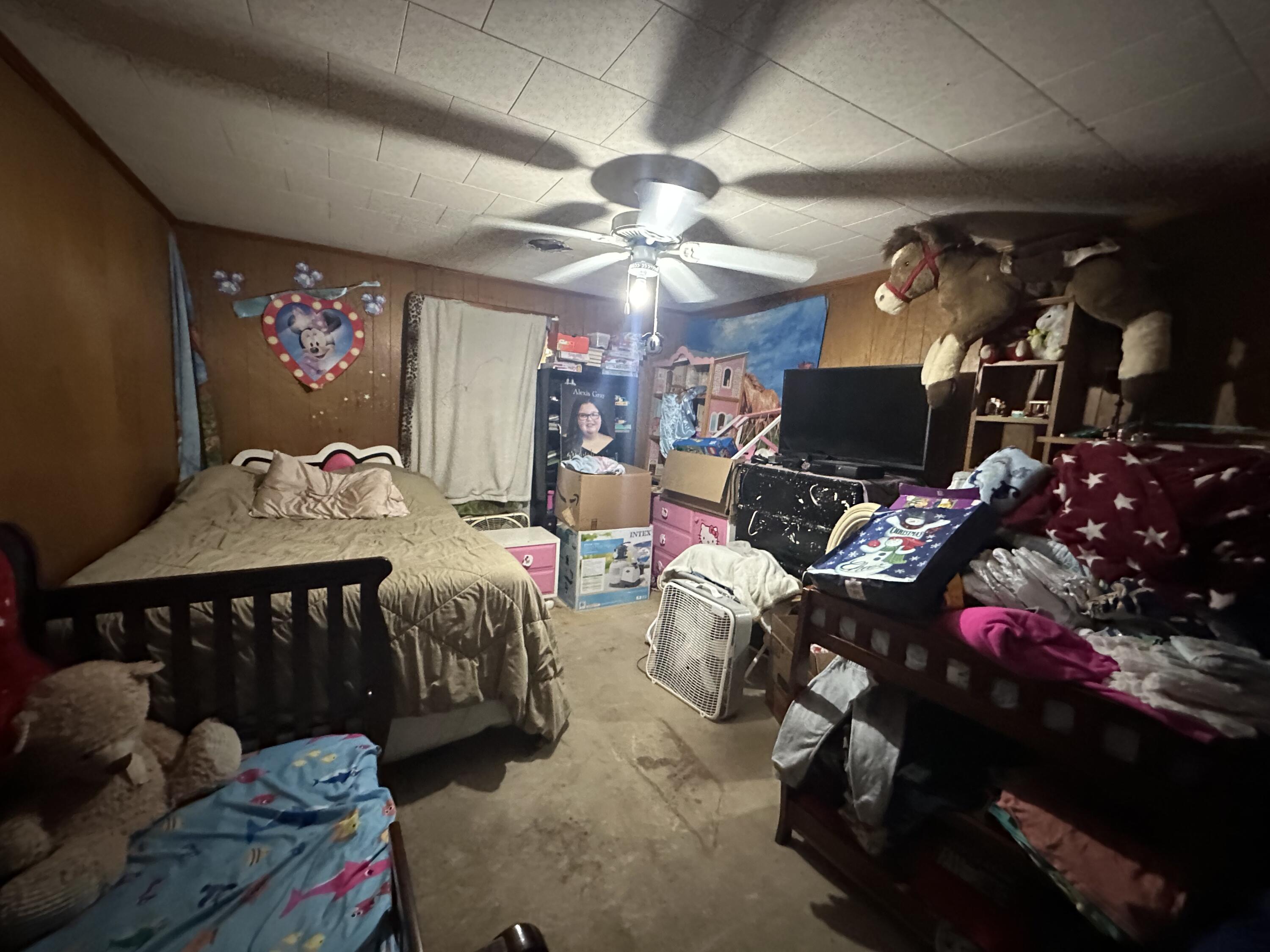 742 Kit Drive Crestview, FL 32536 - Photo 5 of 5 a bedroom with furniture and a flat screen tv