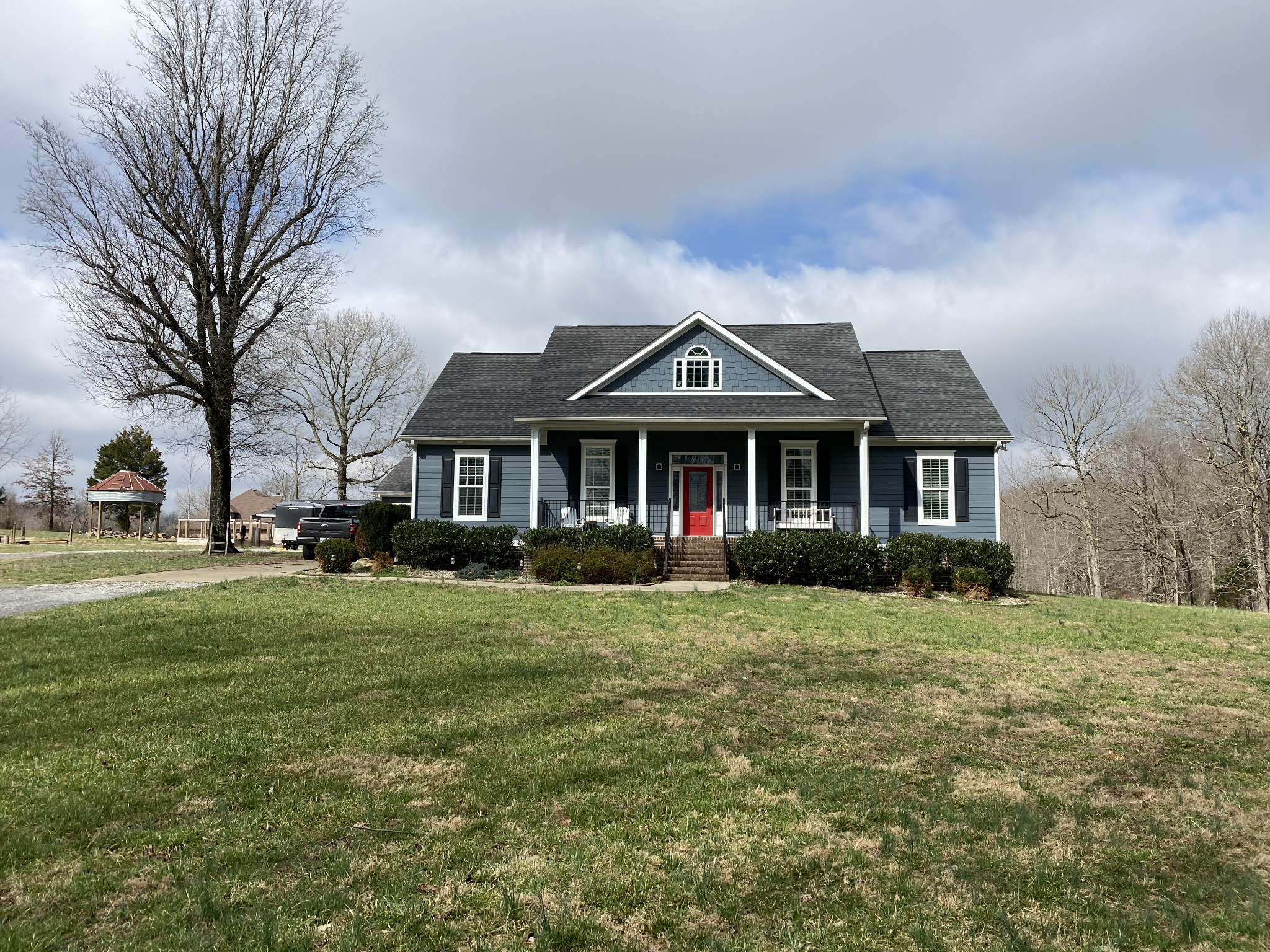 445 Moore Link Road Portland, TN 37148 - Photo 1 of 30 a front view of a house with a yard