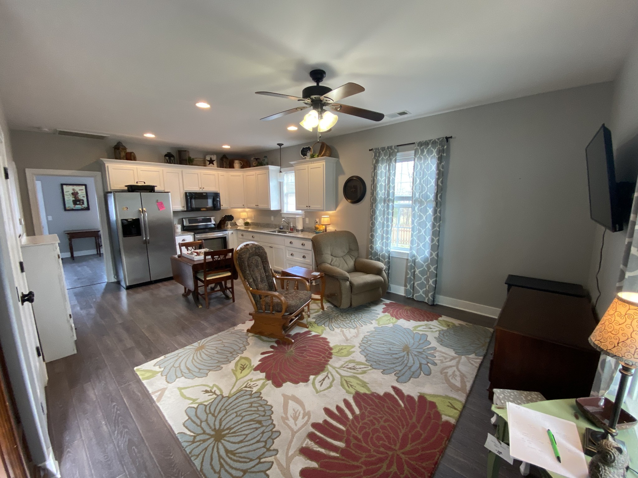 445 Moore Link Road Portland, TN 37148 - Photo 22 of 30 a living room with furniture and a flat screen tv with kitchen view