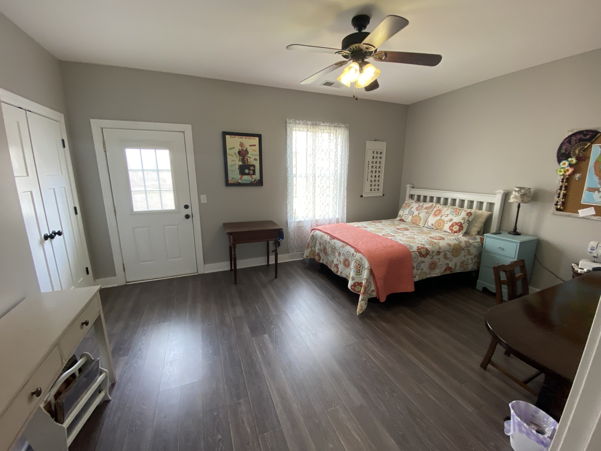 445 Moore Link Road Portland, TN 37148 - Photo 24 of 30 a bedroom with a bed and a chandelier