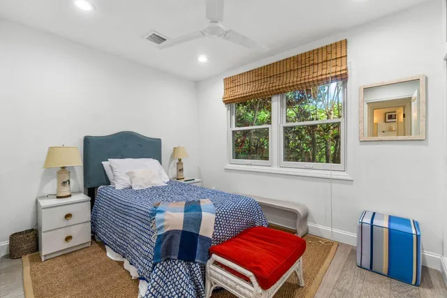 a bedroom with furniture and a window