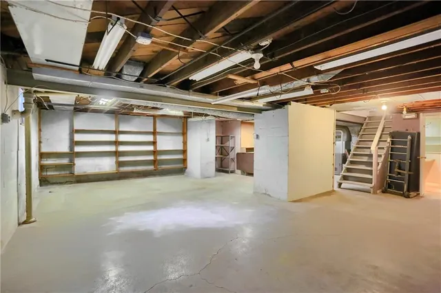 a view of empty room with furniture
