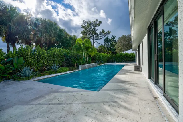 a view of a yard and front view of a house