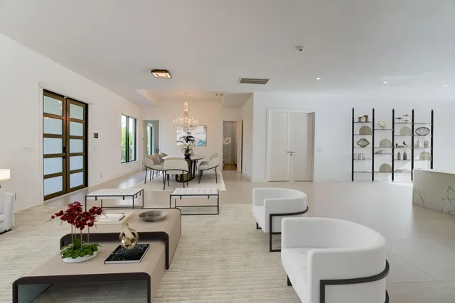 a living room with furniture and a table