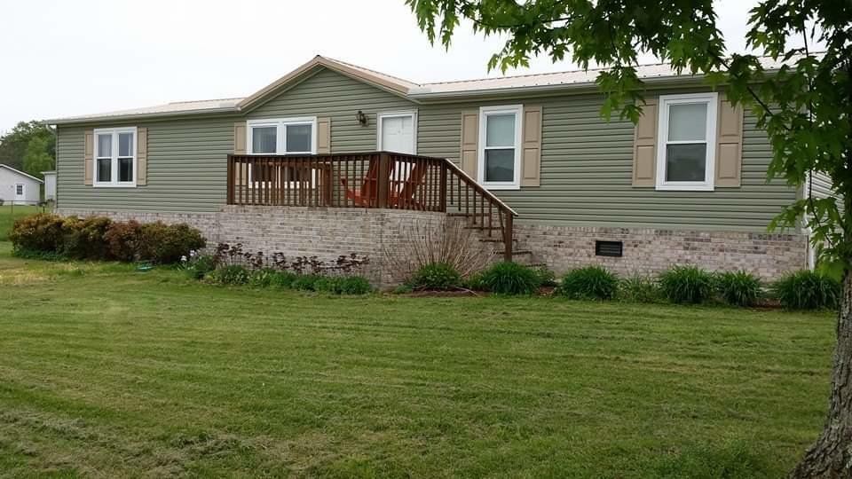 4962 Corinth Church Road Loudon, TN 37774 - Photo 1 of 18 a front view of a house with a garden