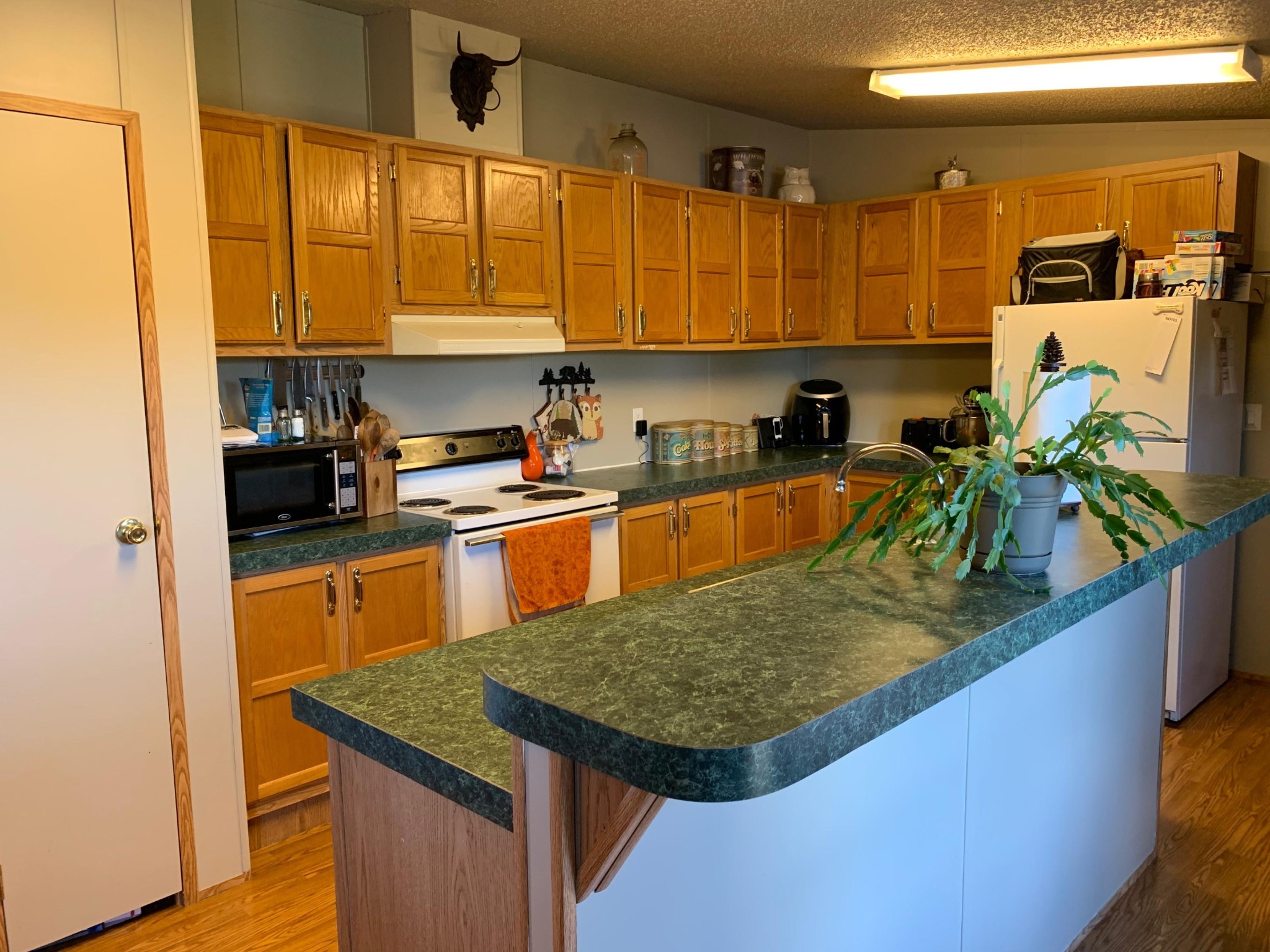 4962 Corinth Church Road Loudon, TN 37774 - Photo 11 of 18 a kitchen with stainless steel appliances granite countertop a sink a stove and a refrigerator