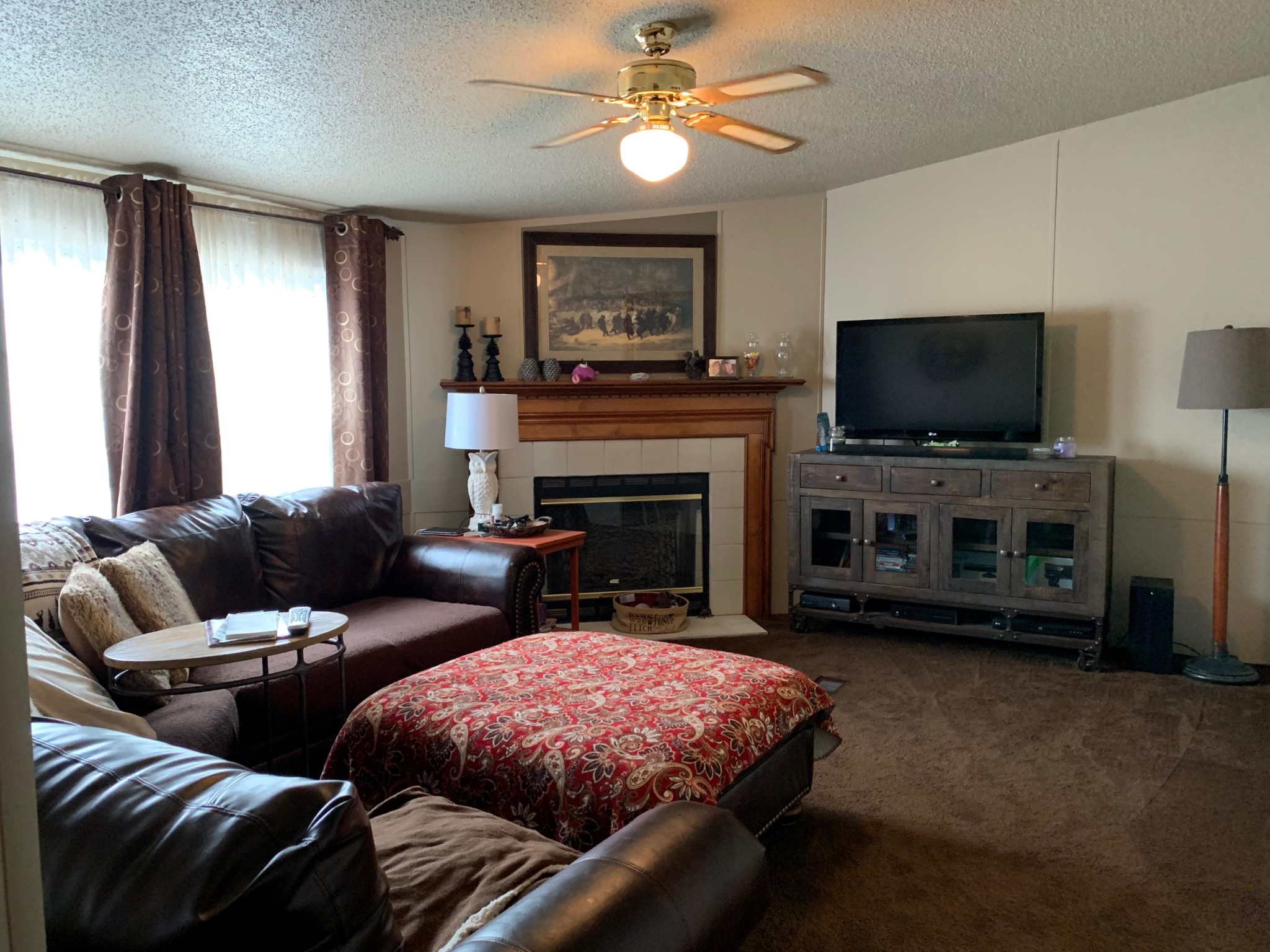 4962 Corinth Church Road Loudon, TN 37774 - Photo 4 of 18 a living room with furniture a flat screen tv and a fireplace
