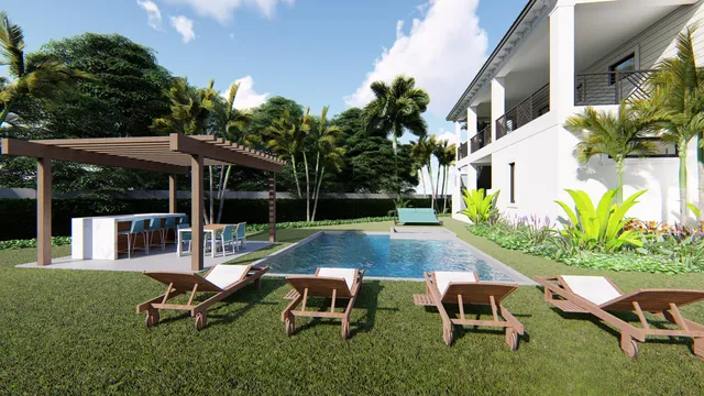 a view of backyard with table and chairs potted plants and large tree