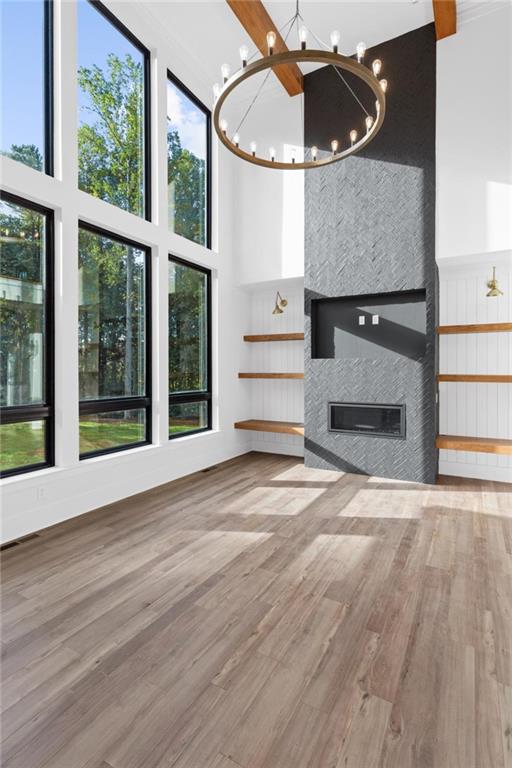 2 Cox Road Woodstock, GA 30188 - Photo 11 of 37 a view of a livingroom with wooden floor and a fireplace