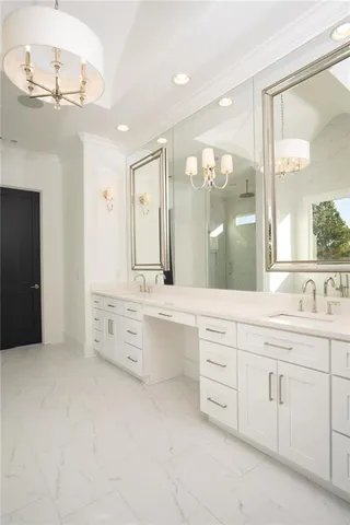 a bathroom with a granite countertop sink mirror and a