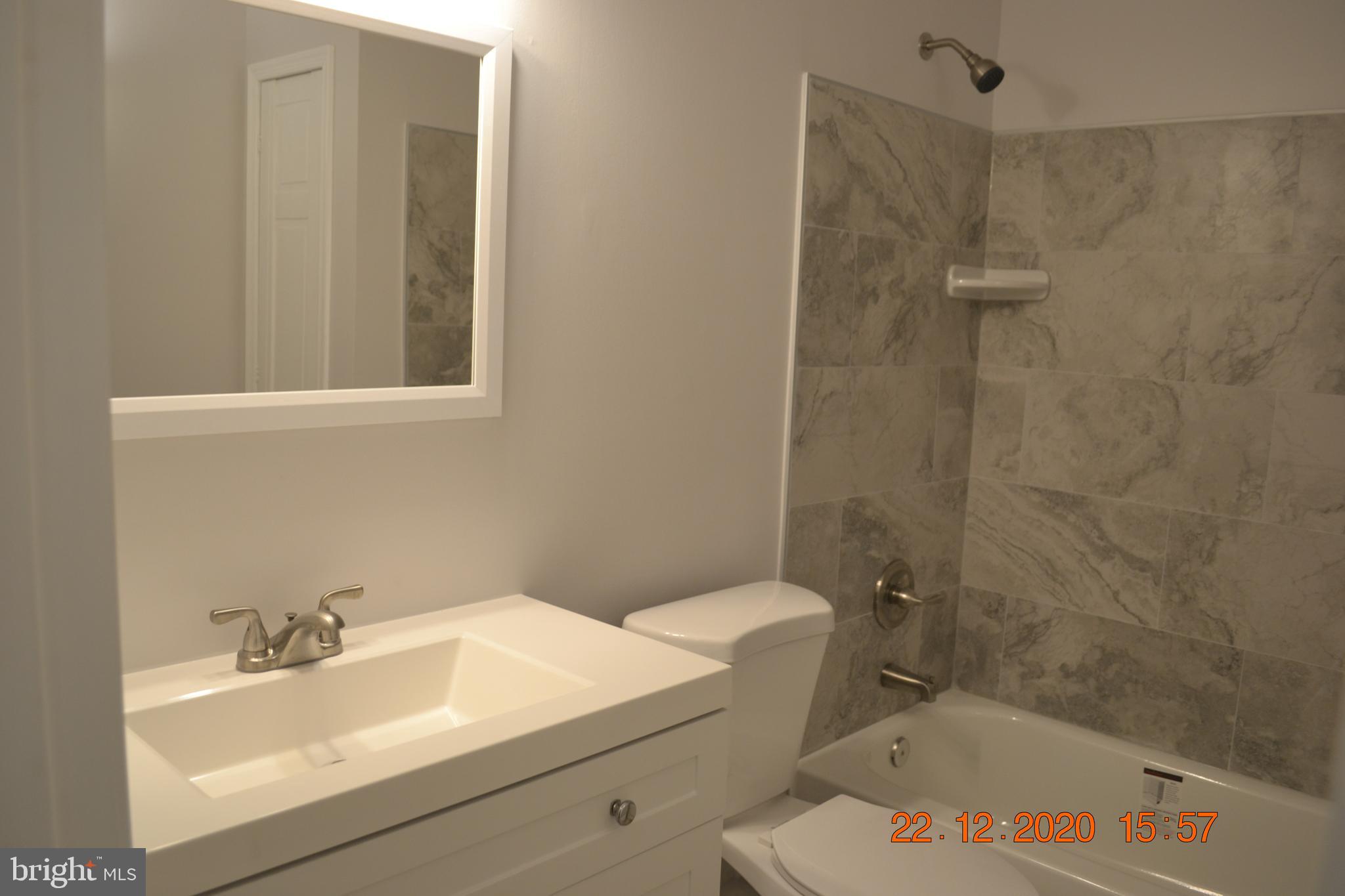 7786 West Shore Road Pasadena, MD 21122 - Photo 20 of 51 Completely remodeled bathroom with ceramic tiles