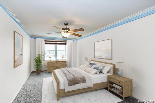 522 Shore Road, Unit 1D Long Beach, NY 11561 - Photo 15 of 22 a bedroom with a bed and a chandelier