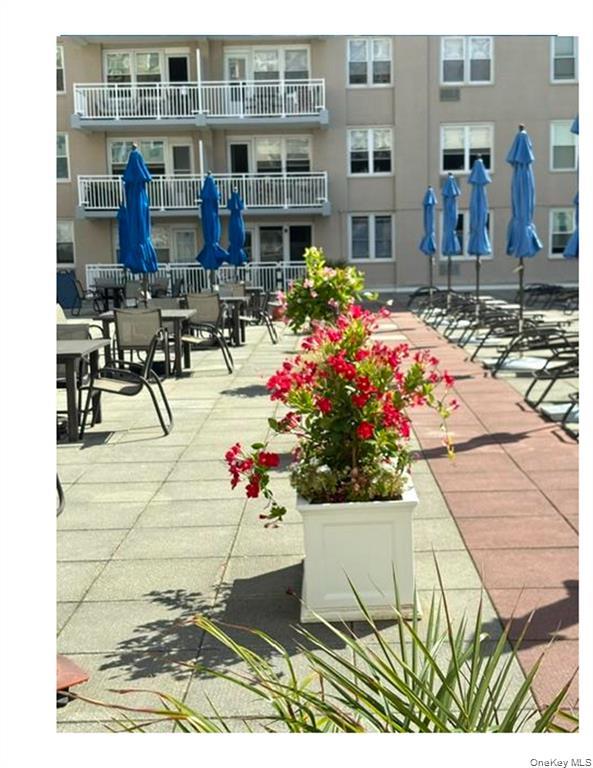 522 Shore Road, Unit 1D Long Beach, NY 11561 - Photo 20 of 22 a view of lot of flowers and buildings