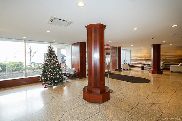 522 Shore Road, Unit 1D Long Beach, NY 11561 - Photo 2 of 22 a lobby with furniture and floor to ceiling window