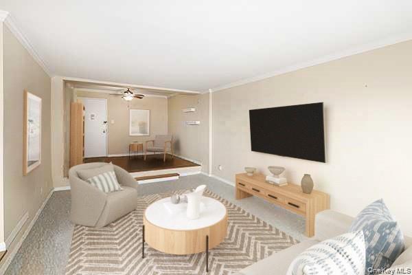 522 Shore Road, Unit 1D Long Beach, NY 11561 - Photo 4 of 22 a living room with furniture and a flat screen tv