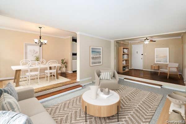 522 Shore Road, Unit 1D Long Beach, NY 11561 - Photo 5 of 22 a living room with furniture and a chandelier