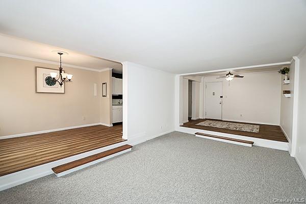 522 Shore Road, Unit 1D Long Beach, NY 11561 - Photo 6 of 22 an empty room with windows