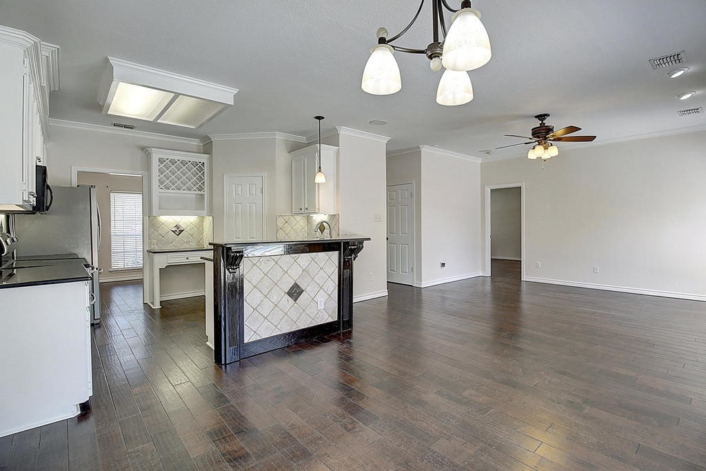 5101 Cavendish Drive Corpus Christi, TX 78413 - Photo 19 of 40 a view of a kitchen with a sink and chandelier
