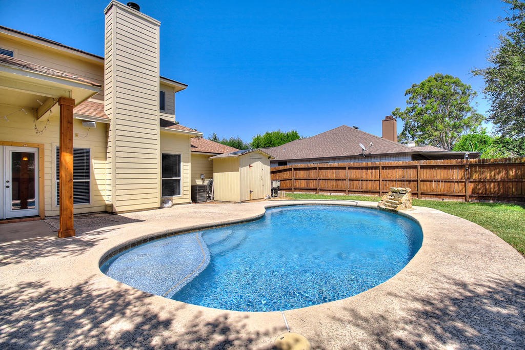 5101 Cavendish Drive Corpus Christi, TX 78413 - Photo 2 of 40 a view of a swimming pool with a lounge chair