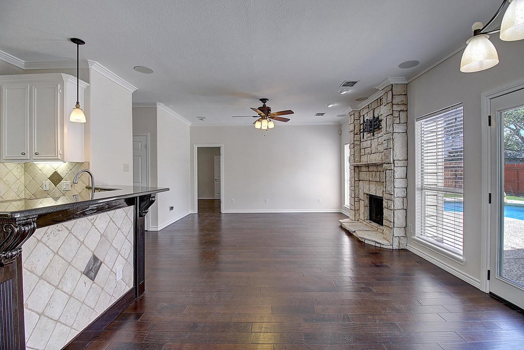 5101 Cavendish Drive Corpus Christi, TX 78413 - Photo 21 of 40 a view of a livingroom with wooden floor and a ceiling fan