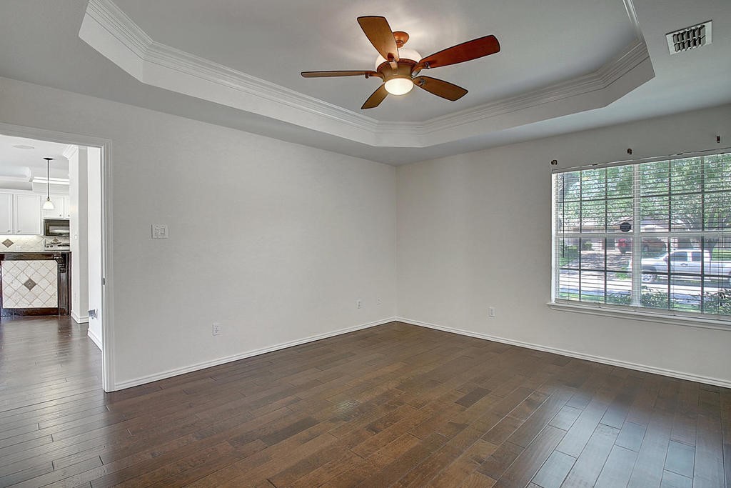 5101 Cavendish Drive Corpus Christi, TX 78413 - Photo 25 of 40 wooden floor in an empty room with a window