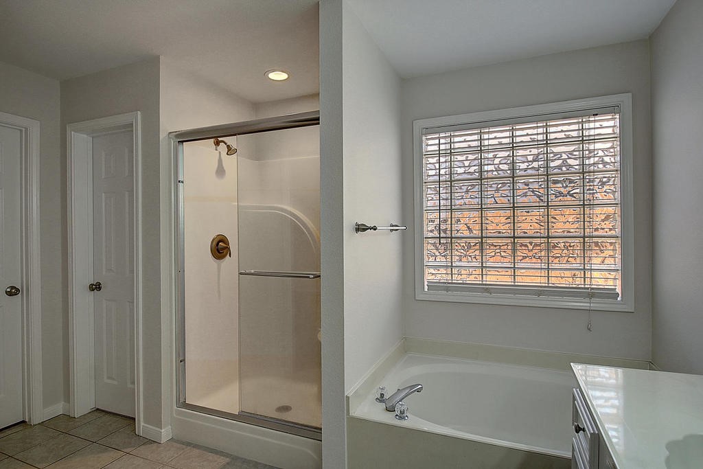 5101 Cavendish Drive Corpus Christi, TX 78413 - Photo 30 of 40 a bathroom with a bathtub and shower