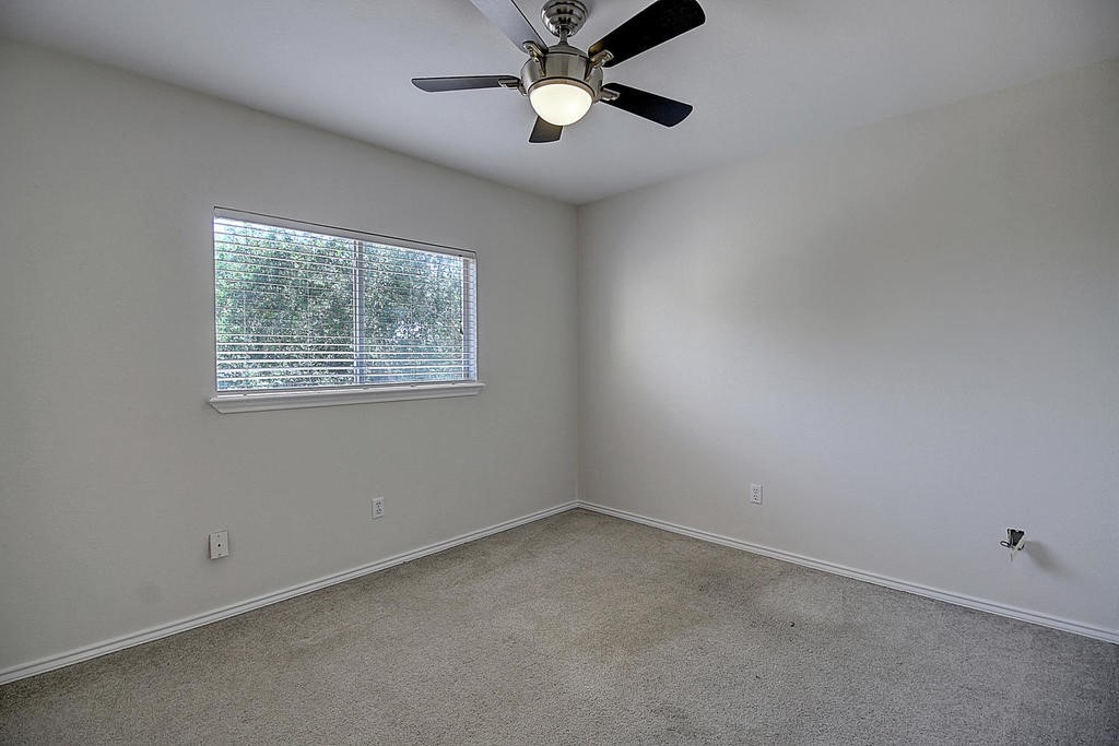 5101 Cavendish Drive Corpus Christi, TX 78413 - Photo 31 of 40 an empty room with a window and a fan
