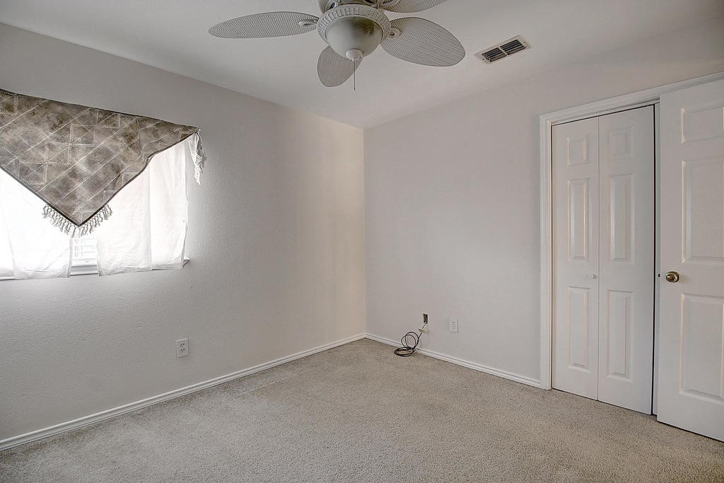 5101 Cavendish Drive Corpus Christi, TX 78413 - Photo 33 of 40 an empty room with a window and a fan