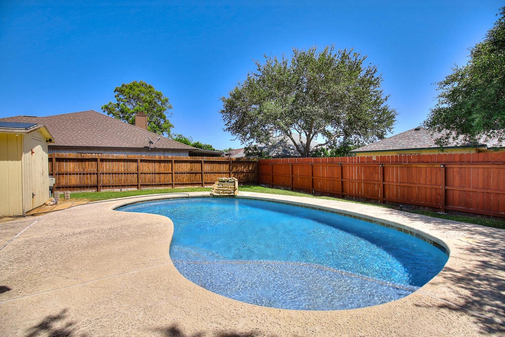 5101 Cavendish Drive Corpus Christi, TX 78413 - Photo 37 of 40 a view of a swimming pool with a yard