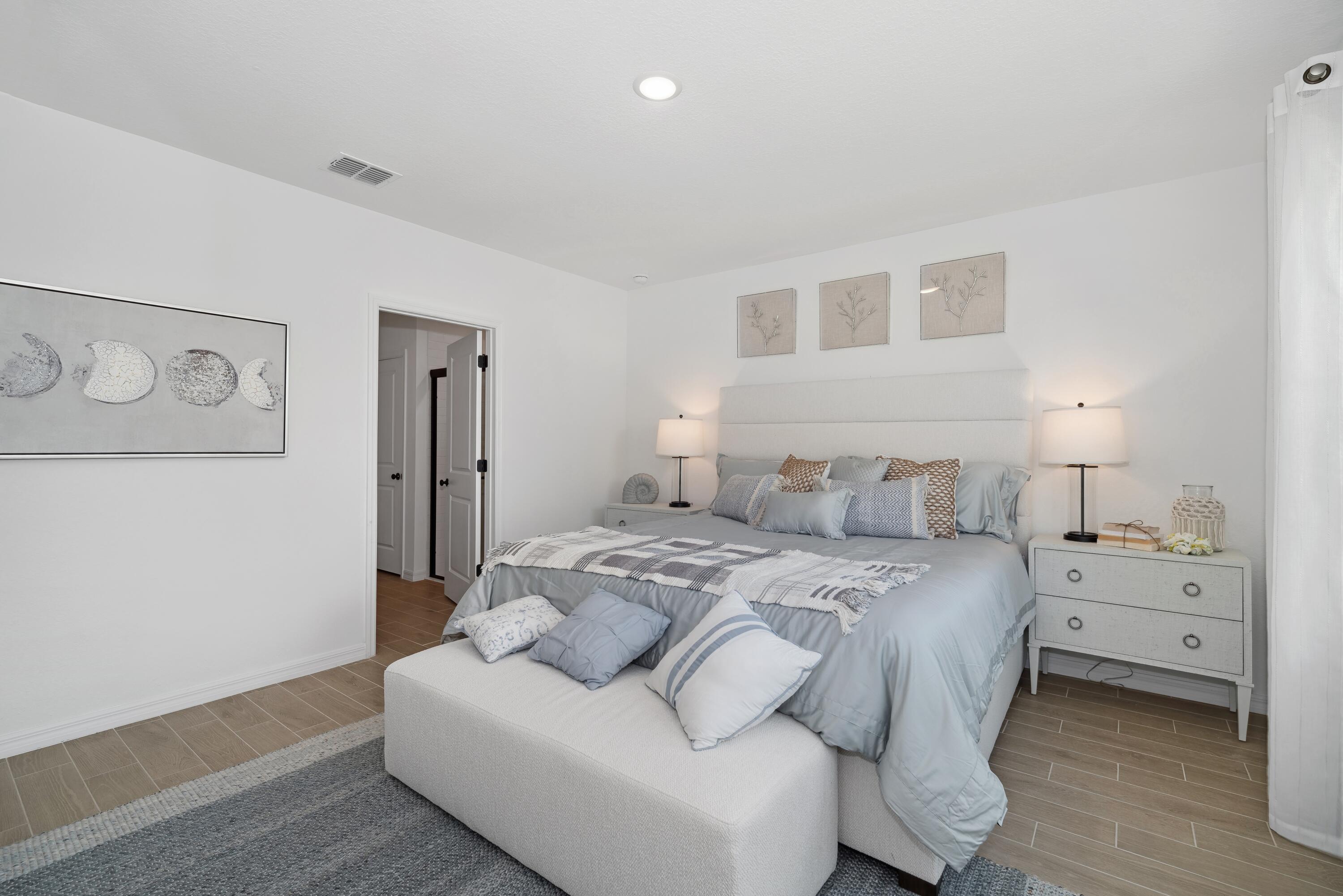 1665 Wyoming Drive Southeast, Unit 100 Palm Bay, FL 32909 - Photo 23 of 29 Primary Suite