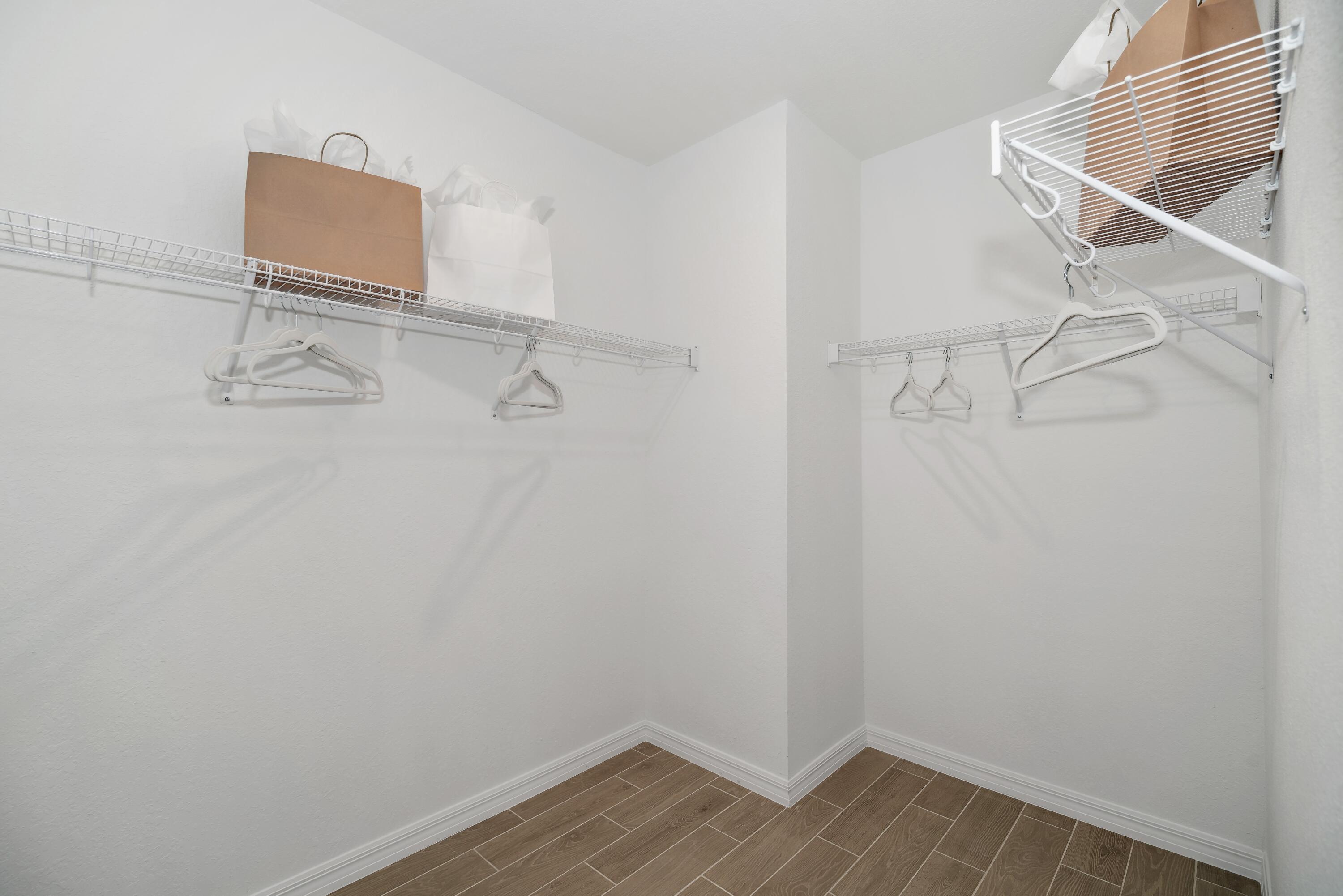 1665 Wyoming Drive Southeast, Unit 100 Palm Bay, FL 32909 - Photo 26 of 29 Primary Walk-in Closet