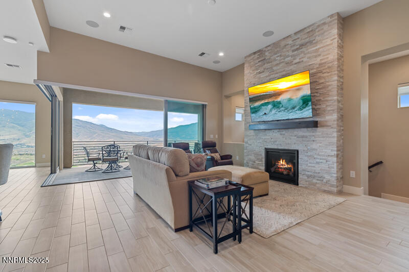 8900 Suncreek Court Reno, NV 89523 - Photo 12 of 74 a living room with furniture and a fireplace