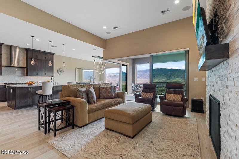 8900 Suncreek Court Reno, NV 89523 - Photo 13 of 74 a living room with furniture and a fireplace