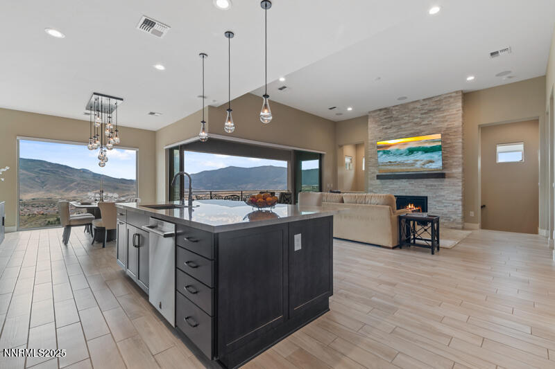 8900 Suncreek Court Reno, NV 89523 - Photo 15 of 74 a kitchen with stainless steel appliances granite countertop a stove and a wooden floors